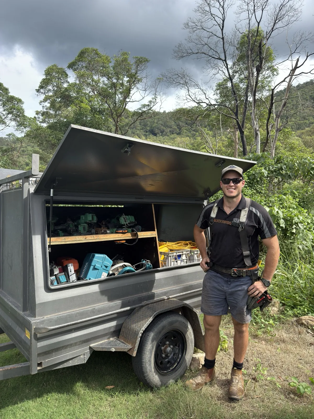 Ben Nudd, owner and carpenter at Your Vision Carpentry, beside his tool trailer on a job in the Samford hills